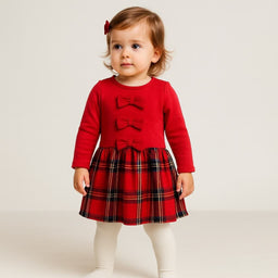 Abitino a maniche lunghe con fiocchetti decorativi